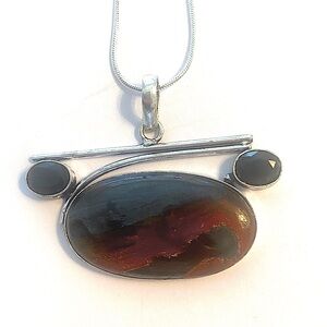 1 1/2 inch. X 2 inch, Iron Tiger Eye and Black Onyx pendant on a silver chain